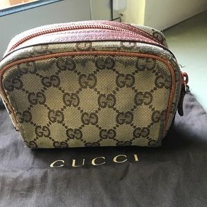 Gucci cosmetic bag.  Orange beige color